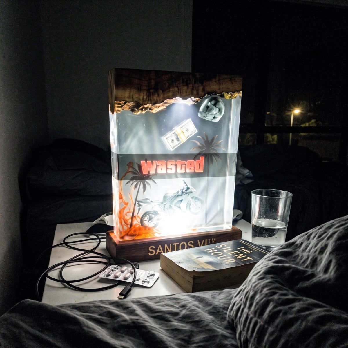Santos VI lamp on a bedside table
